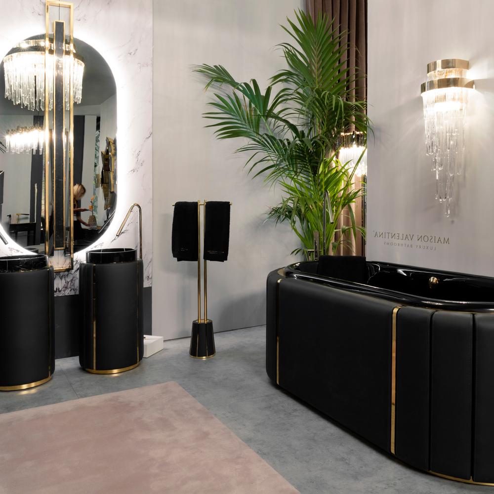 Luxurious bathroom featuring a curvy black bathtub, stylish vanity units, and elegant lighting.