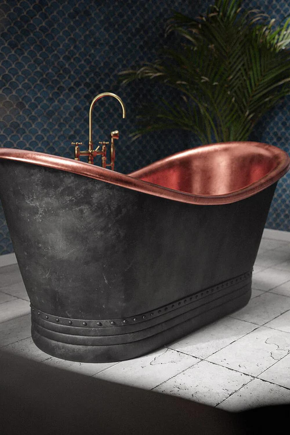 Contemporary bathroom featuring a curvy black bathtub and a textured blue wall.