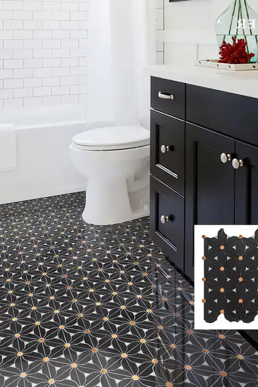 Stylish bathroom featuring floral-patterned mosaic tiles and a serene atmosphere.