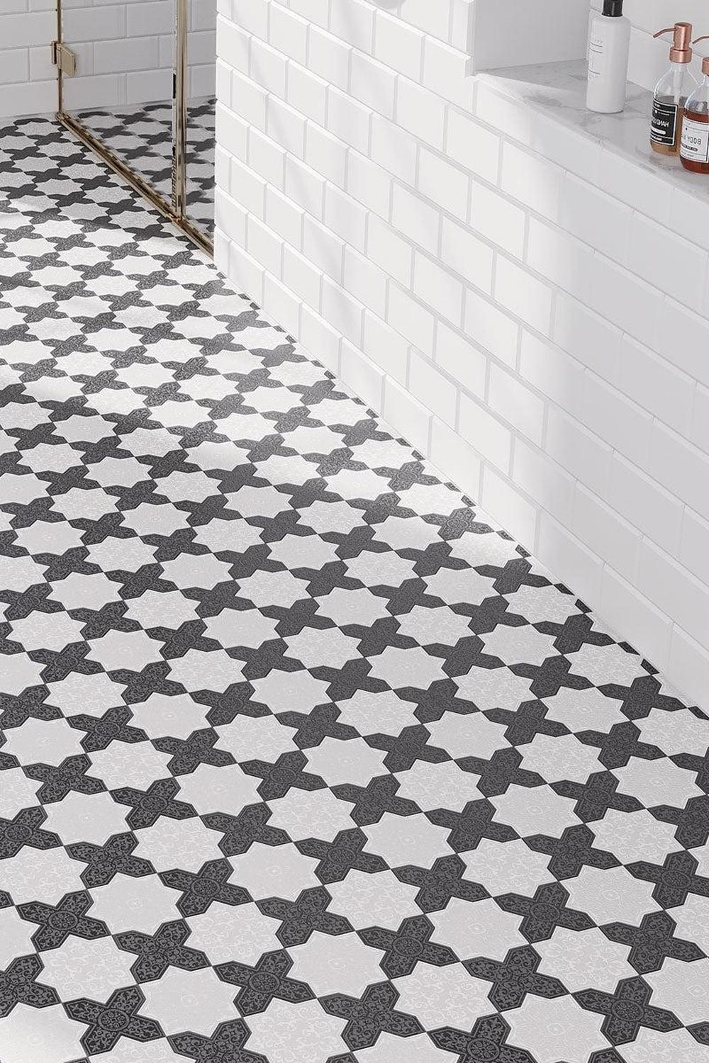 Stylish bathroom featuring playful mosaic shapes emphasizing modern aesthetics.