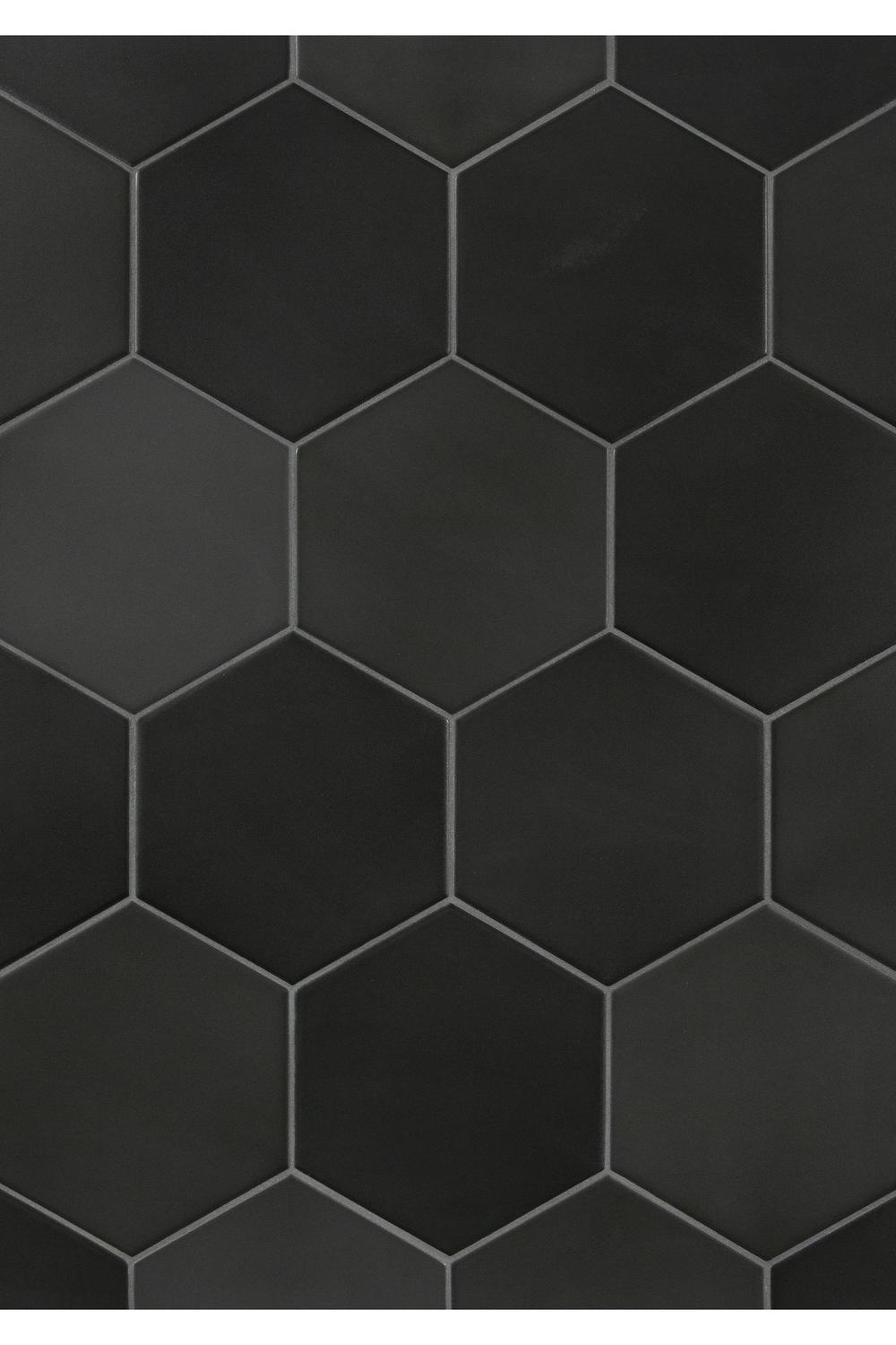Elegant sink area emphasized by black hexagon tiles.