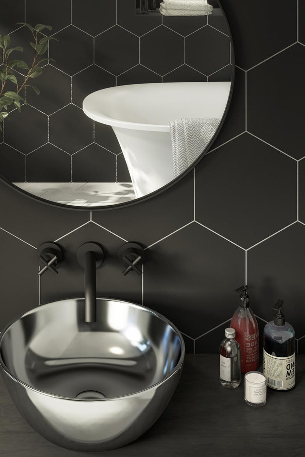 Bathroom design showcasing personality with black hexagon tiles and decor.