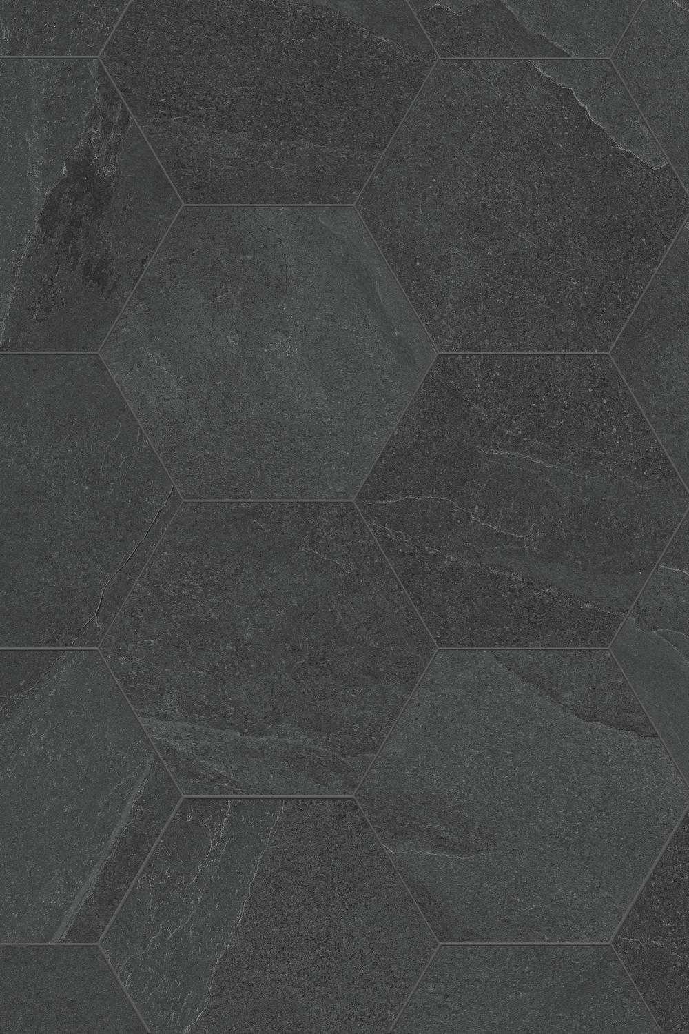 Room with black hexagon tiles harmonizing with transparent elements for a natural feel.