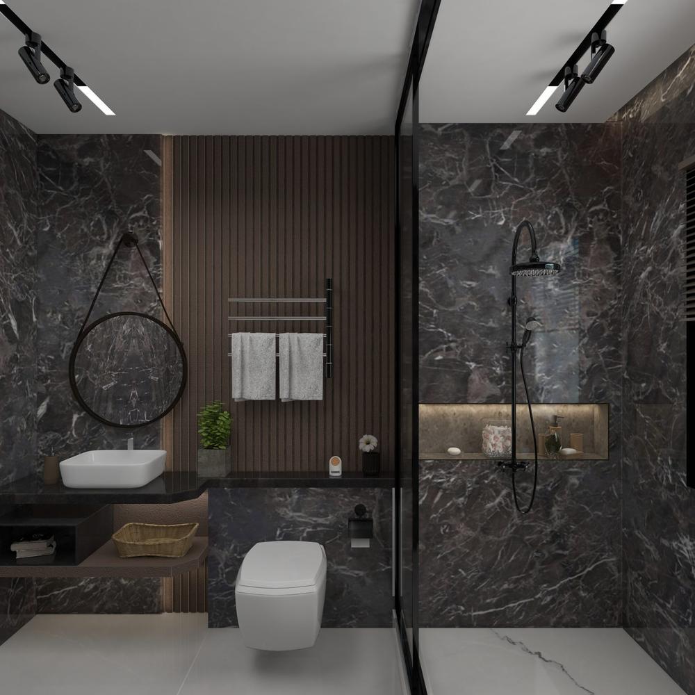 Un baño con mármol negro que destaca el lujo cotidiano