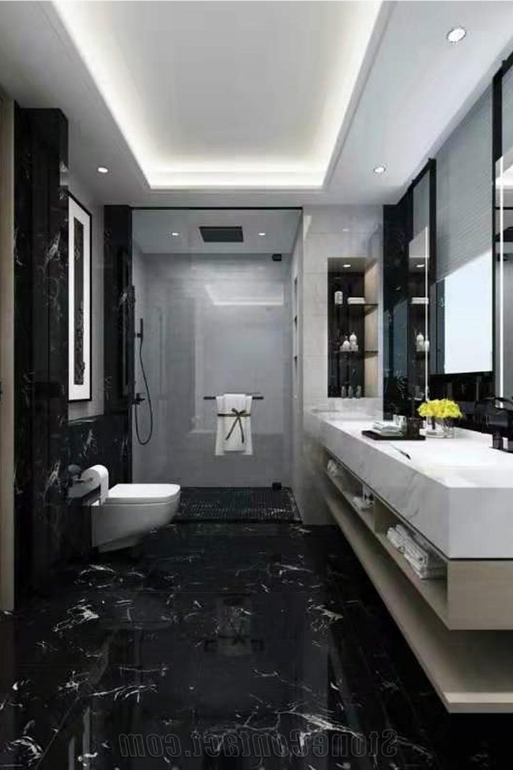 Baño elegante con mármol negro y diseño contemporáneo