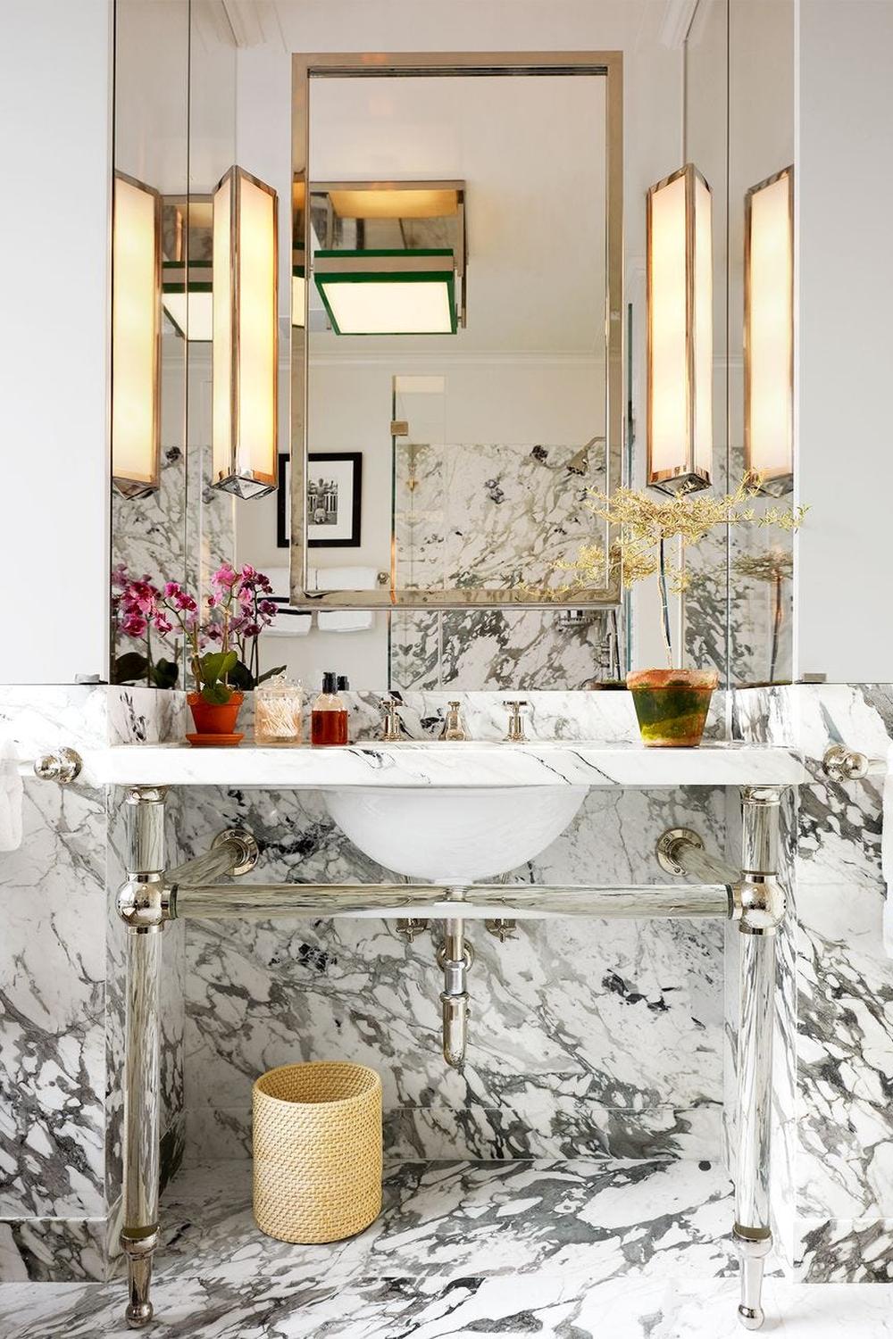 A sophisticated bathroom with luxurious marble surfaces and contemporary design.