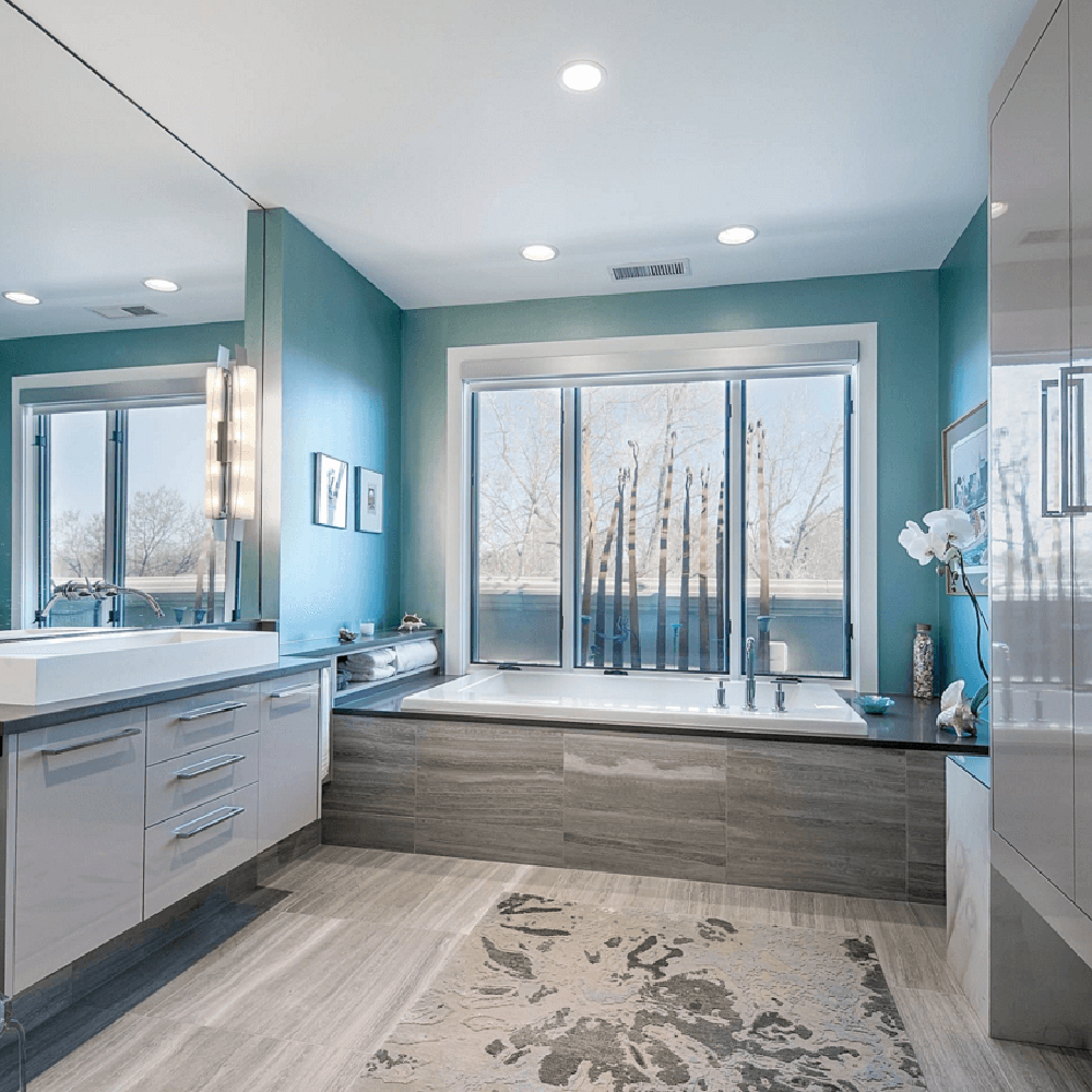 Tranquil blue colors and warmth in bathroom