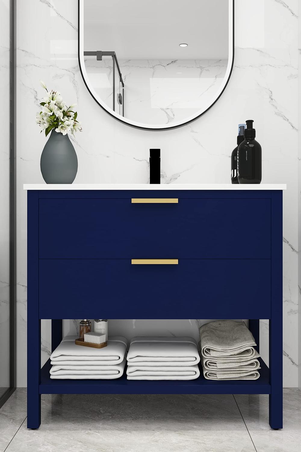 Contemporary blue bathroom vanity with circular mirror and ambient lighting.