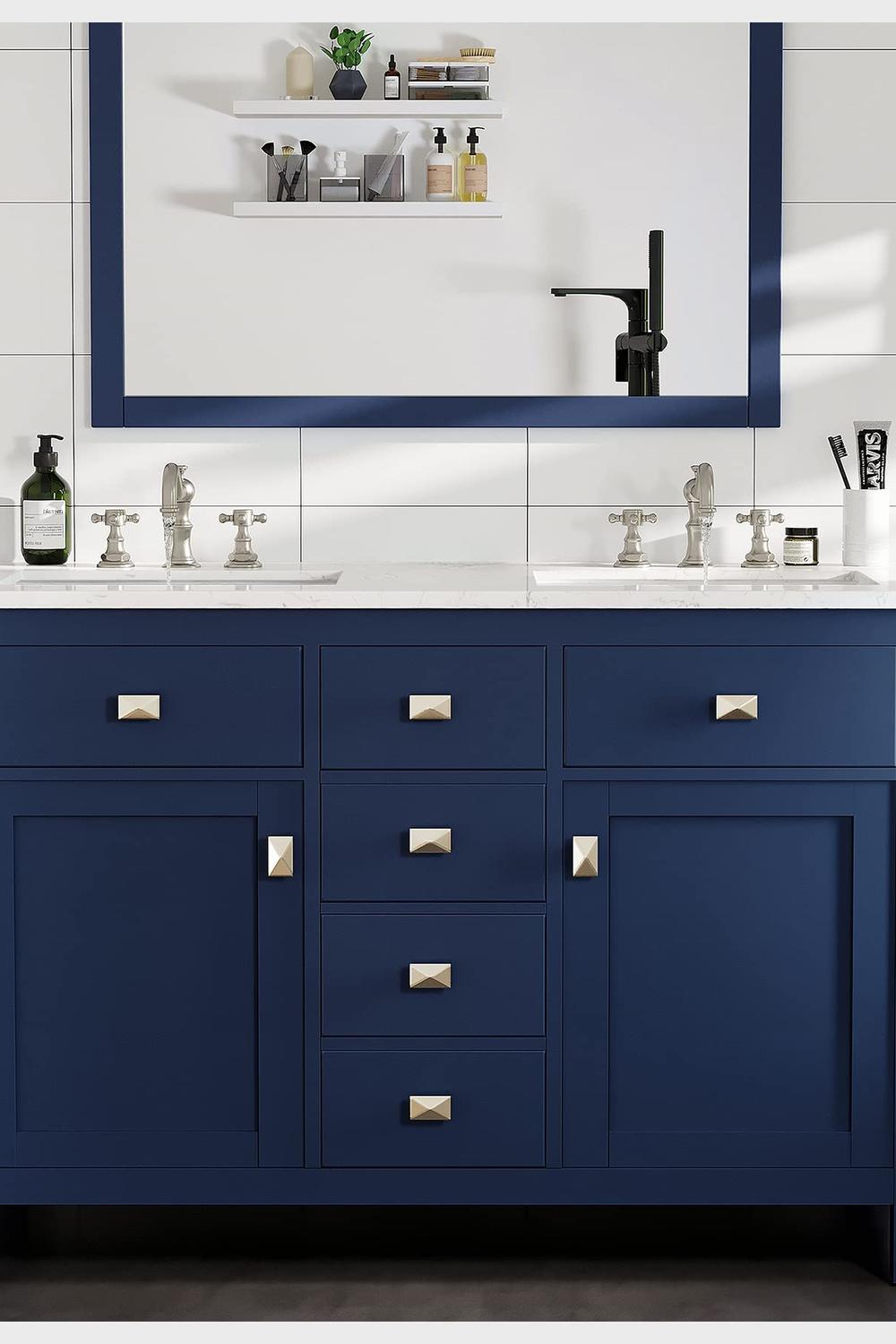 Dual-sink blue vanity with elegant chrome faucets in a contemporary setting.