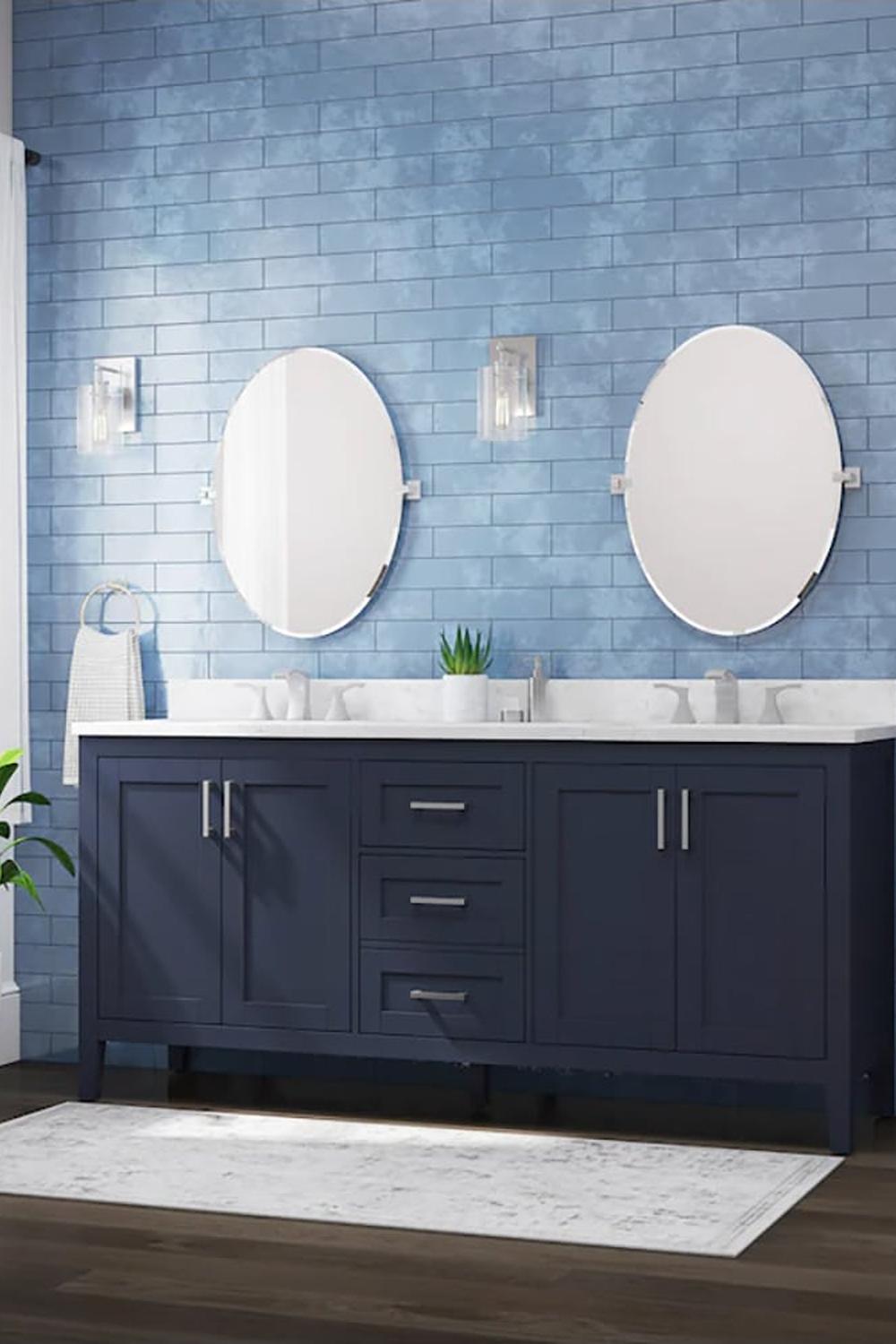 Elegant deep navy blue vanity with round mirrors in a modern bathroom.