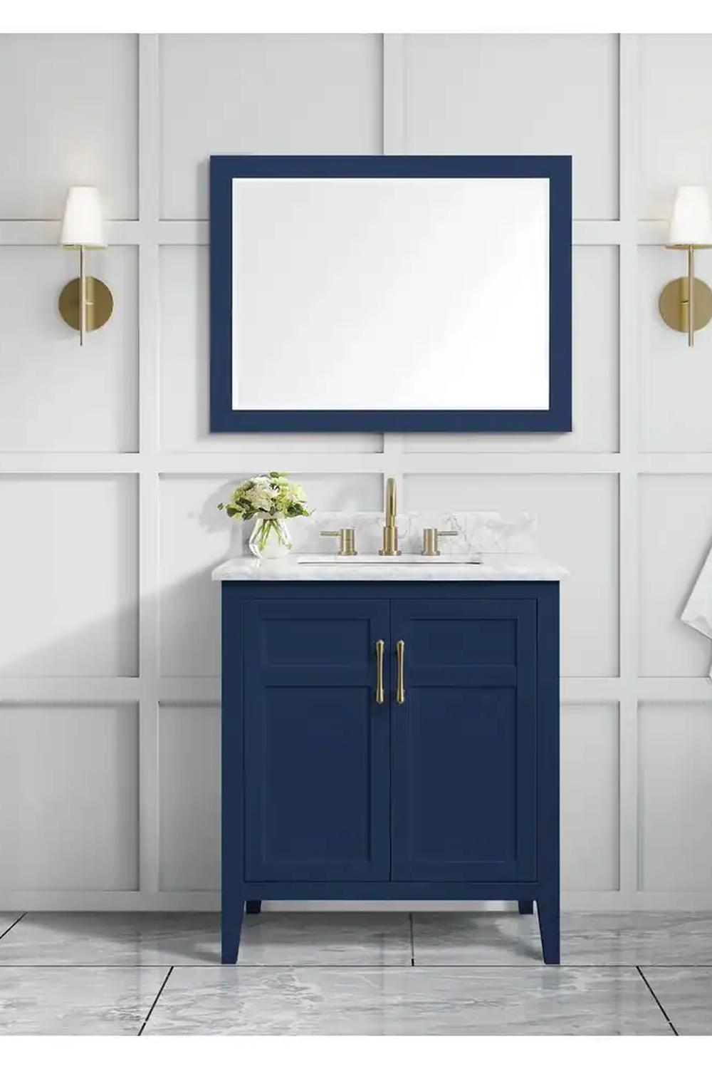 Textured blue vanity with a sophisticated marble top and decorative elements.