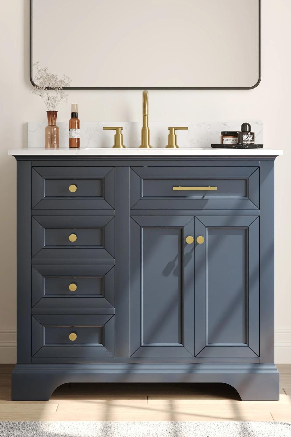 Traditional-style blue bathroom vanity with a smooth finish and golden fixtures.