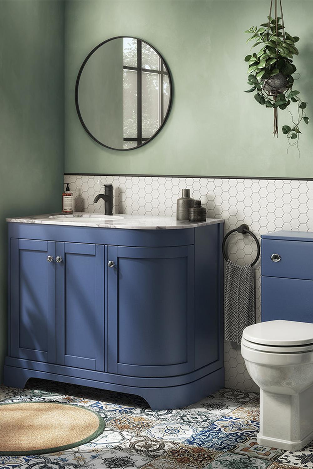 Stylish blue vanity with unique accent colors in a vibrant bathroom design.