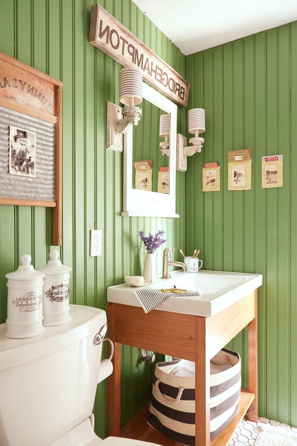A lively boho chic bathroom showcasing bright green walls with vertical paneling.