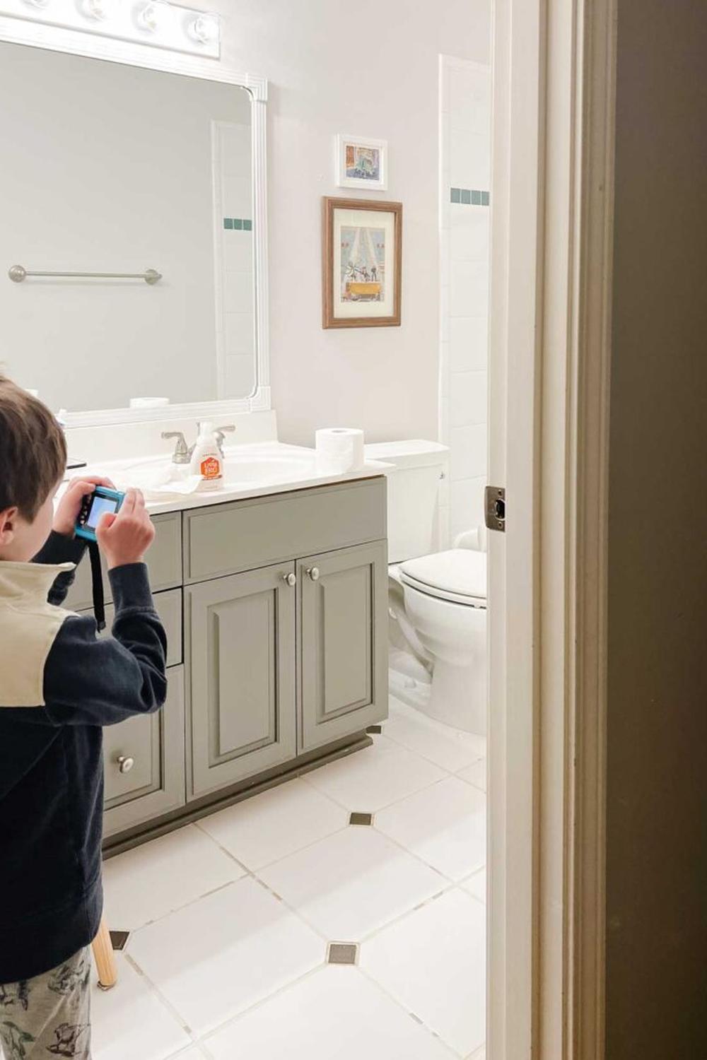 Modern boys bathroom featuring stylish blue and white elements