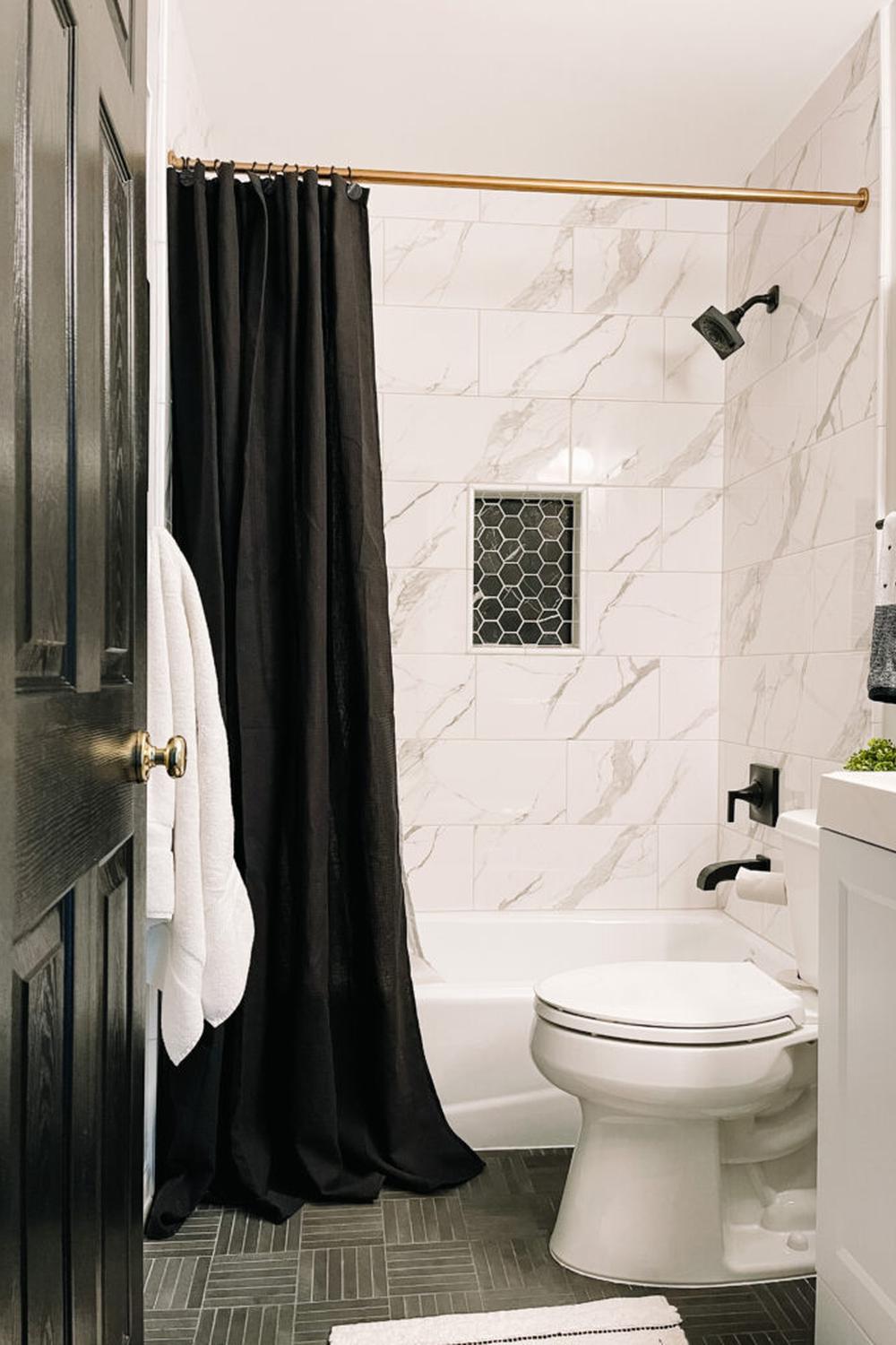 A minimalist boys bathroom featuring modern accents