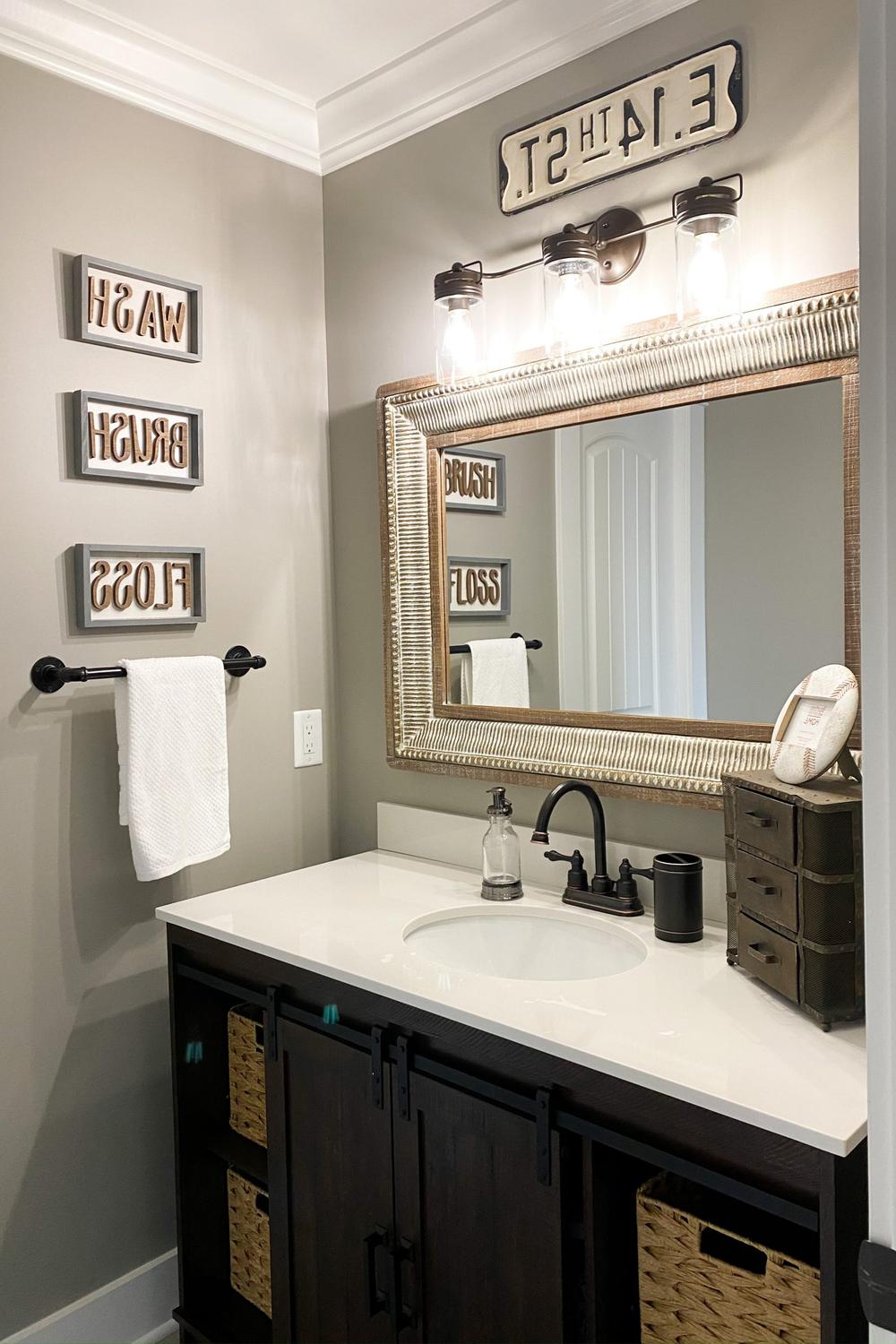 Stylish boys bathroom with whimsical decor and neutral tones.