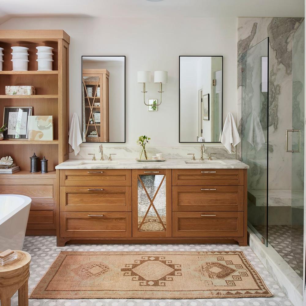 An Inviting Bathroom with a Brown Vanity That Integrates Various Textures