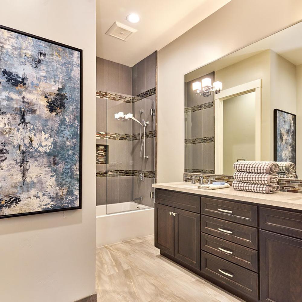 Bright and Airy Bathroom Design Featuring a Brown Vanity that Comfortably Adapts to Needs