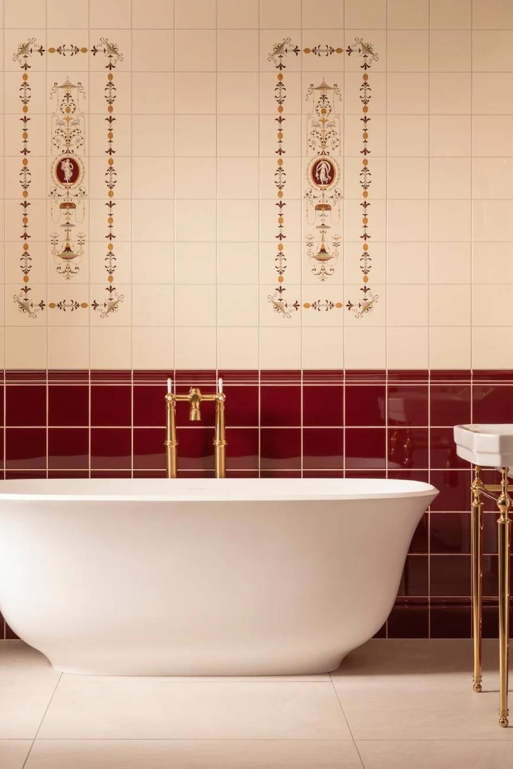 A beautifully designed bathroom featuring burgundy tiles and sophisticated accents.