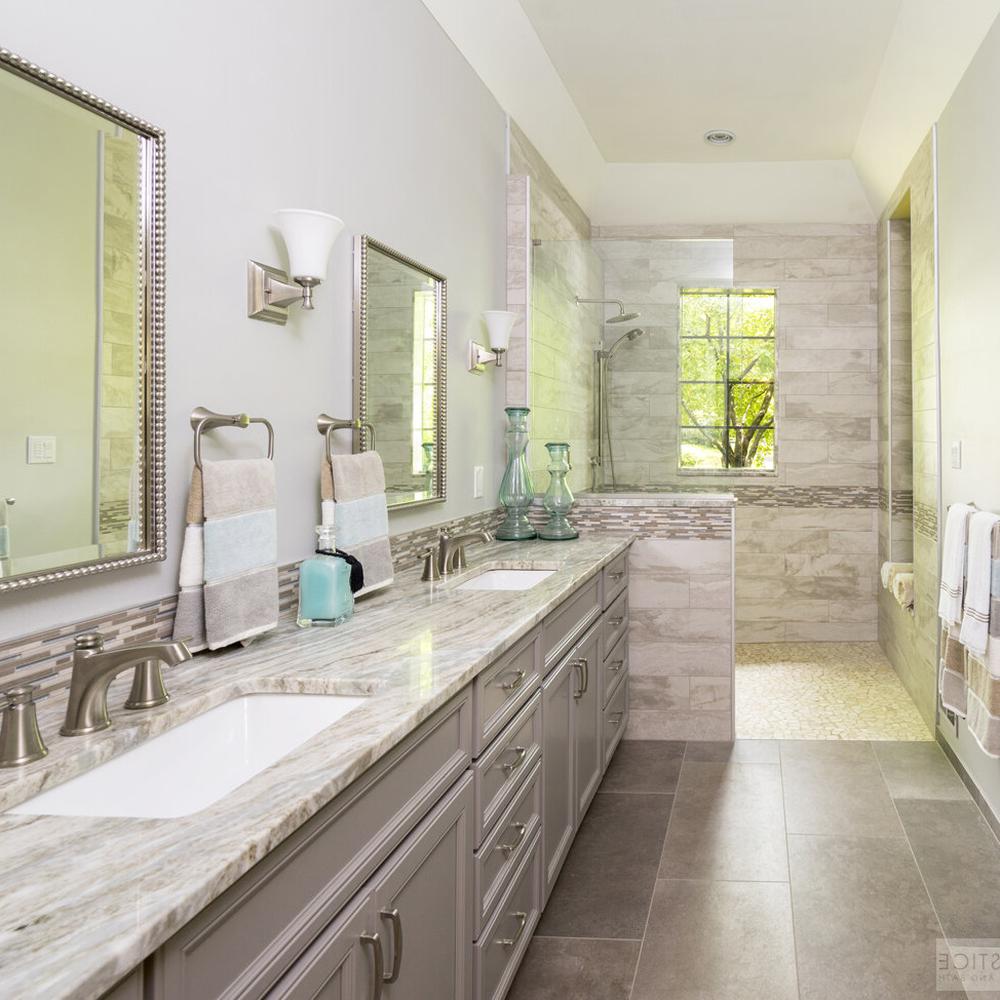 Elegant bathroom design featuring dual sinks, sophisticated cabinetry, and natural light.