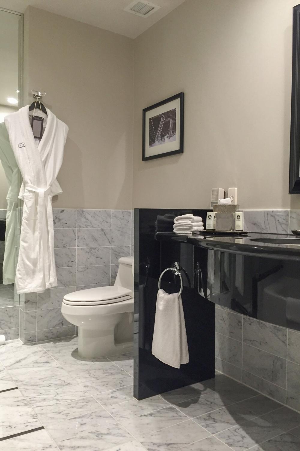 Refined bathroom design with classic Carrara marble and contemporary features
