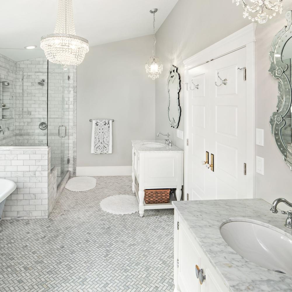 Inviting bathroom space featuring natural Carrara marble details