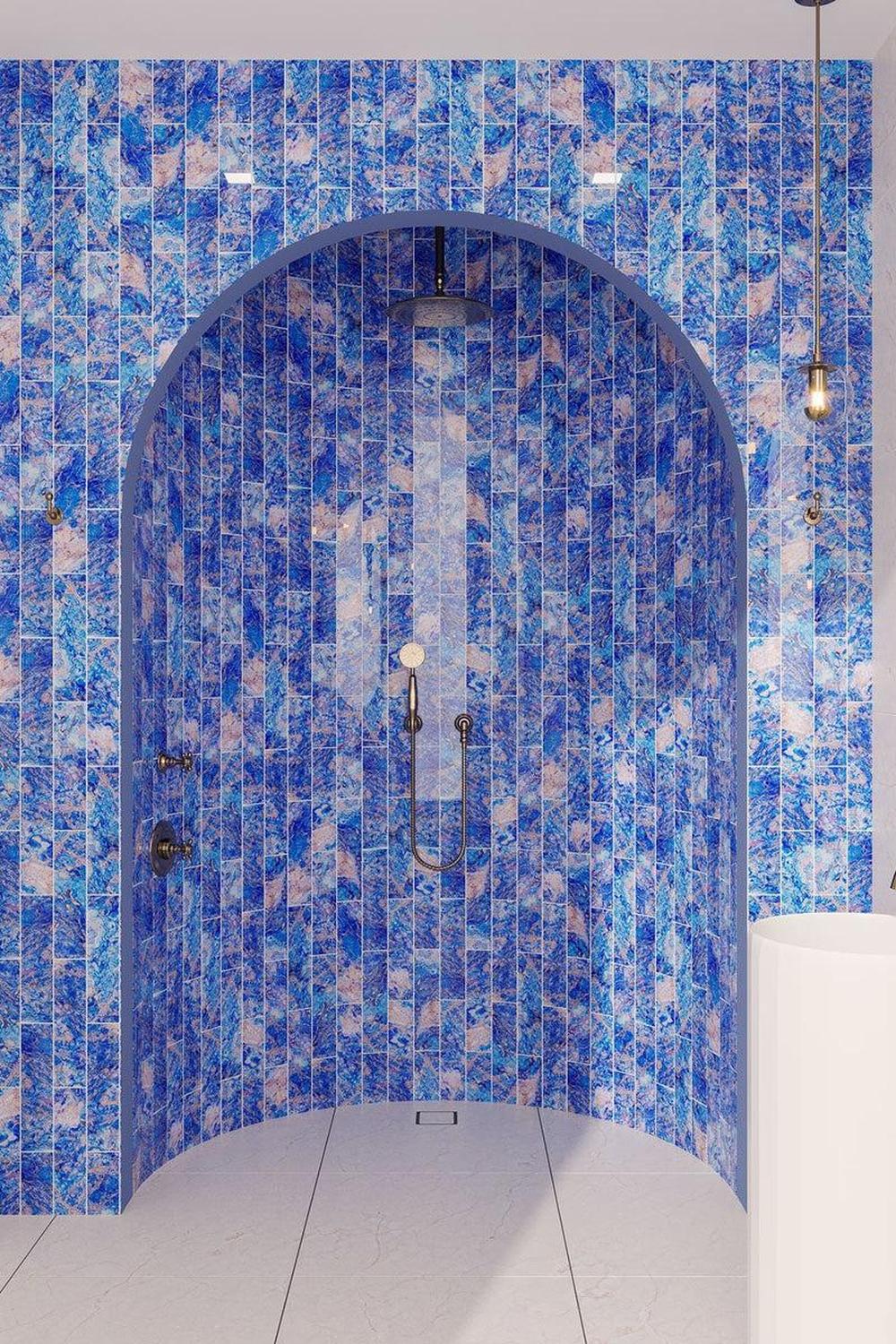 mosaic wall design in a celestial-themed bathroom.