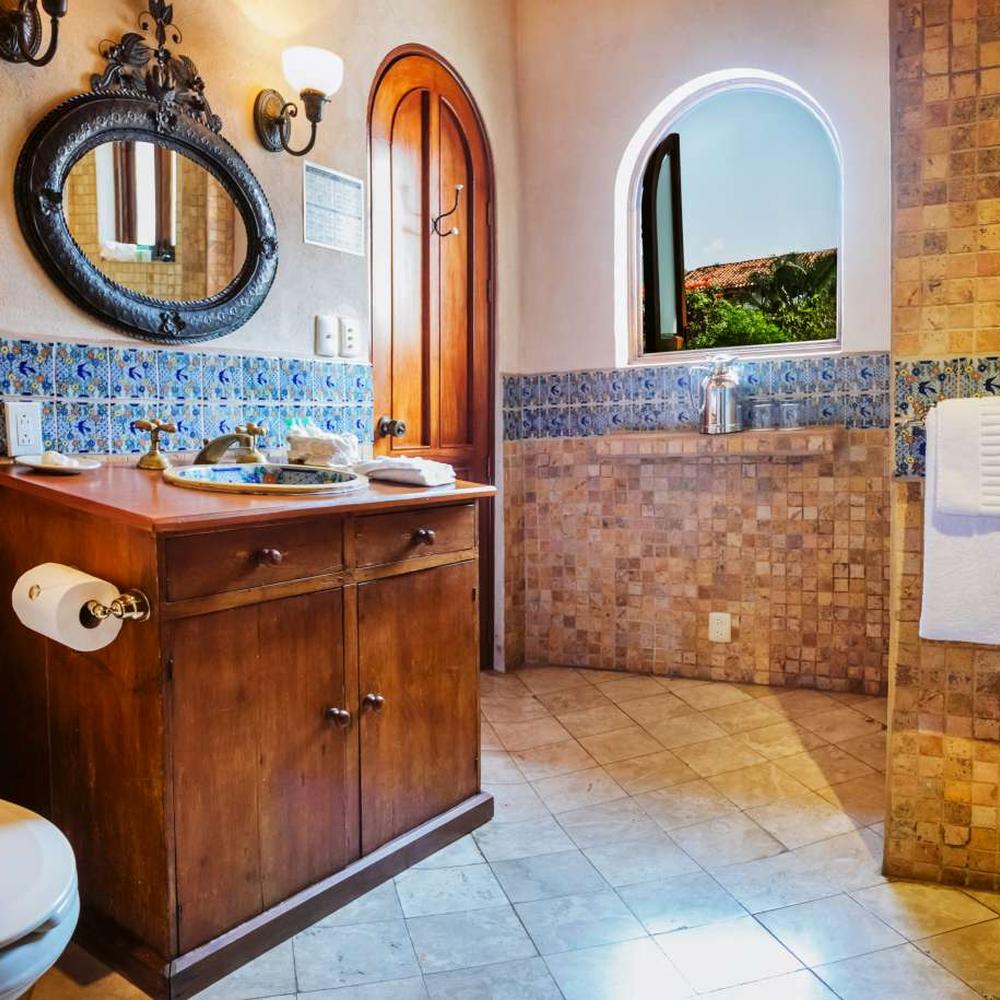 Rustic charm with warm elements in a cozy celestial bathroom space.