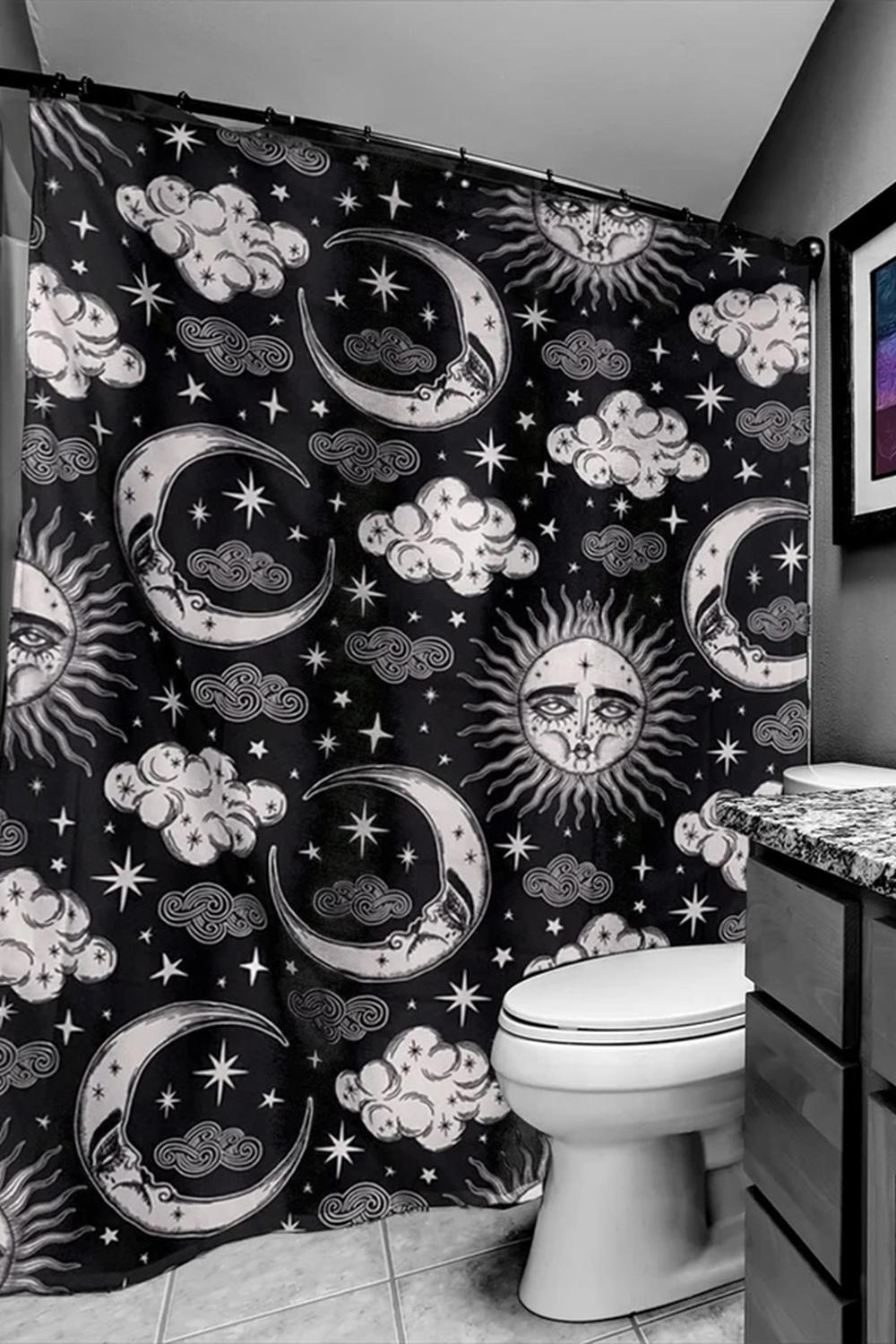 Dramatic solar system design in a celestial-themed bathroom space.