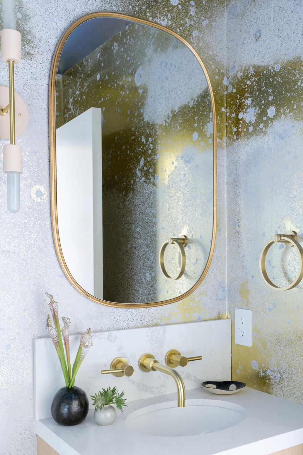 Mock solar system imagery in a beautifully designed celestial bathroom.