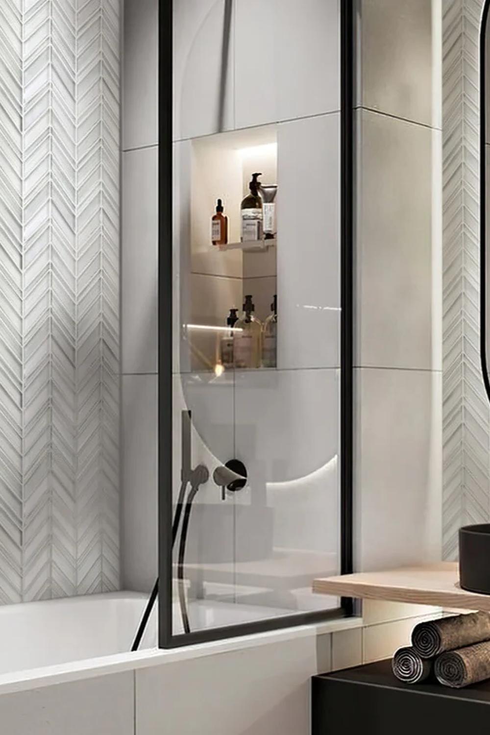 Stylish bathroom with neutral chevron tile design.