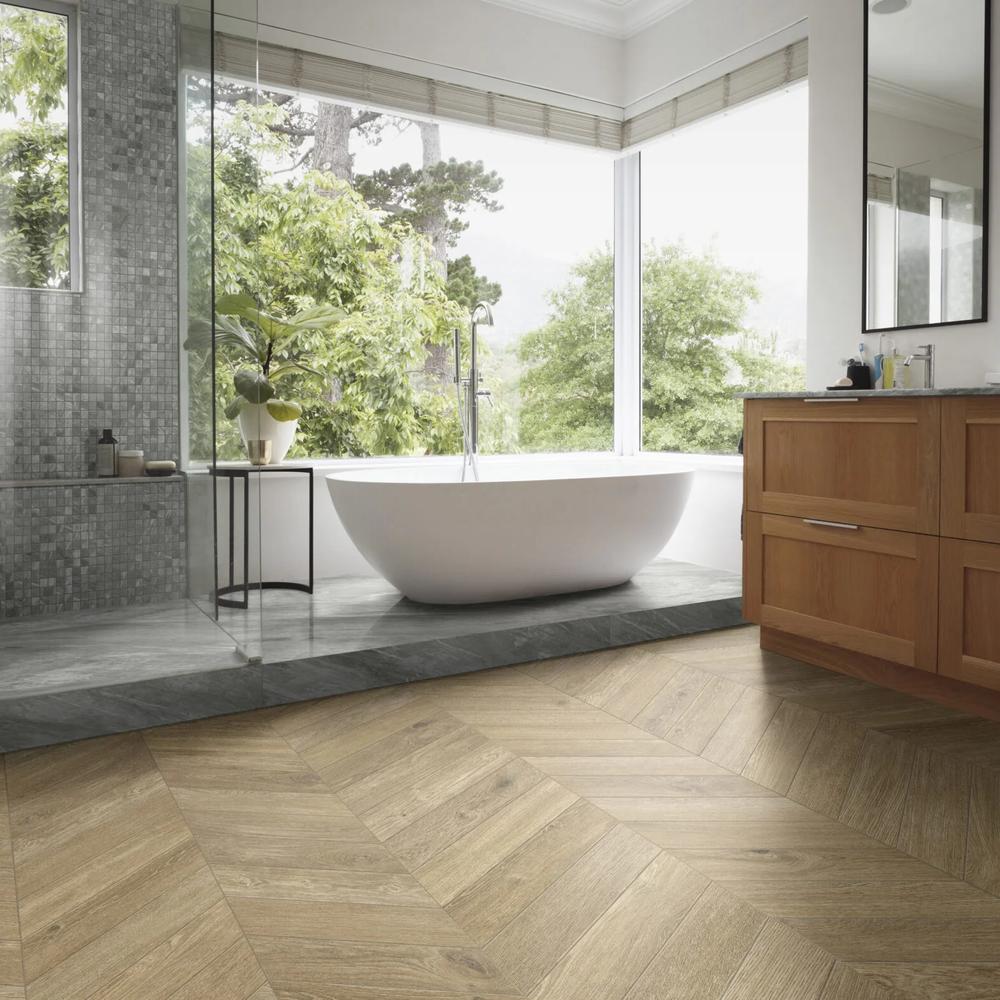Stylish bathroom featuring chevron pattern wood-like tiles.