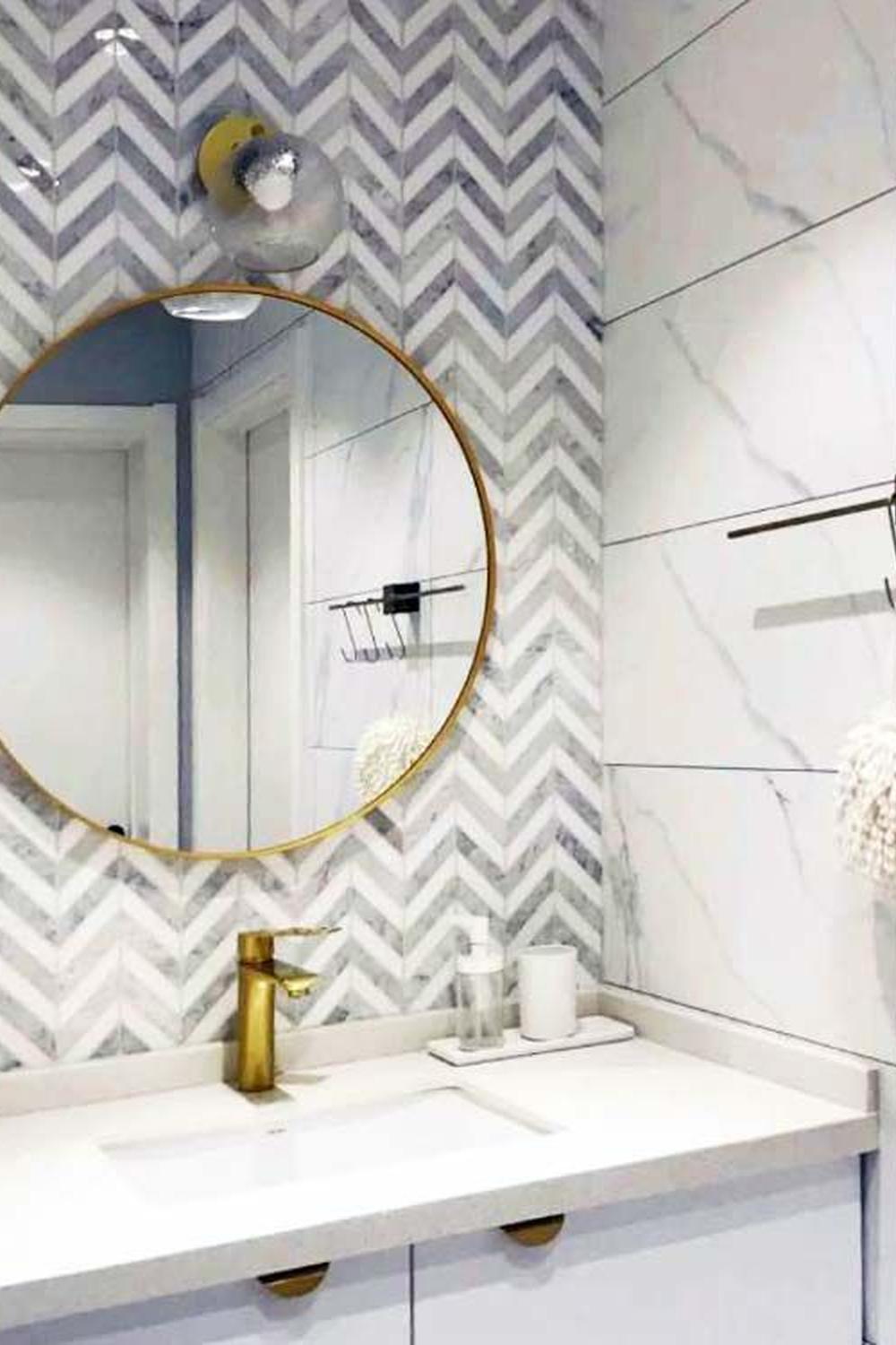 Modern bathroom showcasing elegant chevron tile wall.
