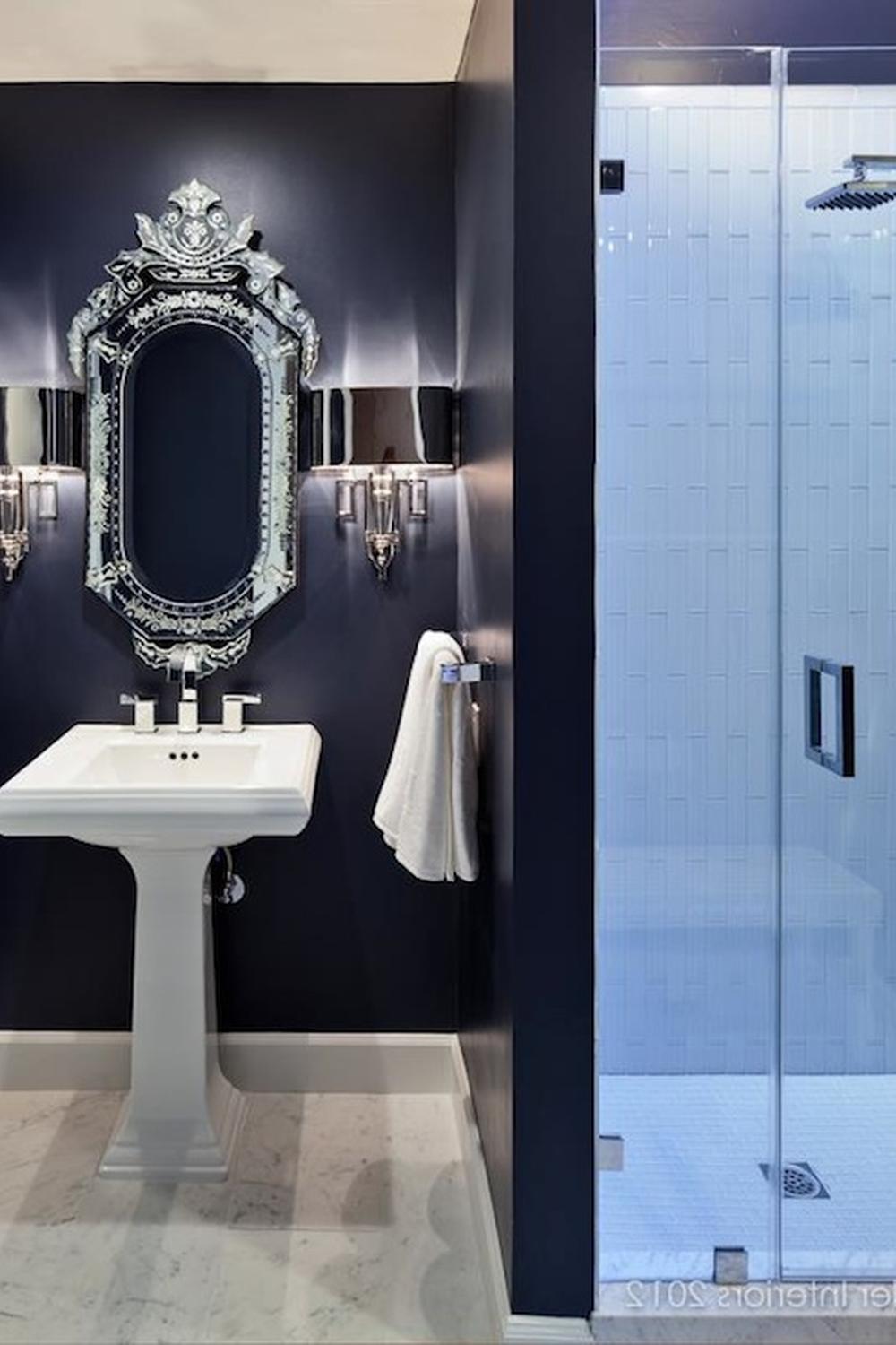 Timeless navy bathroom with sophisticated classic elements and modern features.