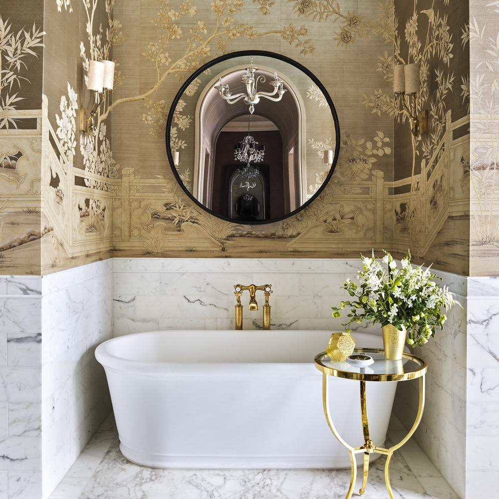 Faithful recreation of lush bamboo and floral Chinoiserie wallpaper in a serene bathroom setting, combined with elegant fixtures and a luxurious tub.