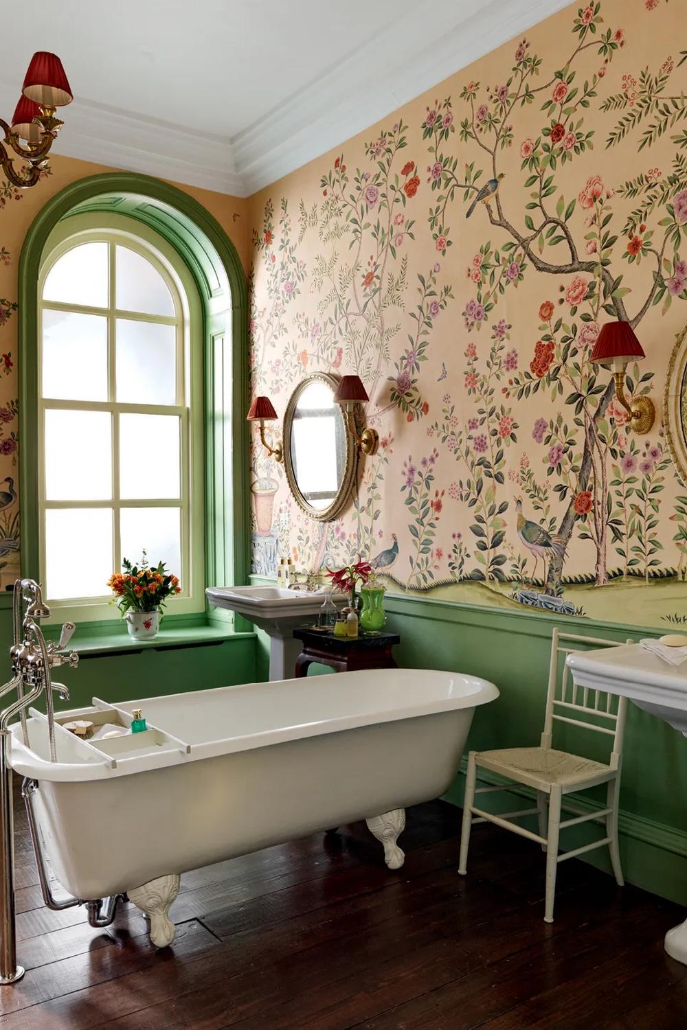 Elegant peachy Chinoiserie wallpaper complemented by sophisticated fixtures in a serene bathroom design.