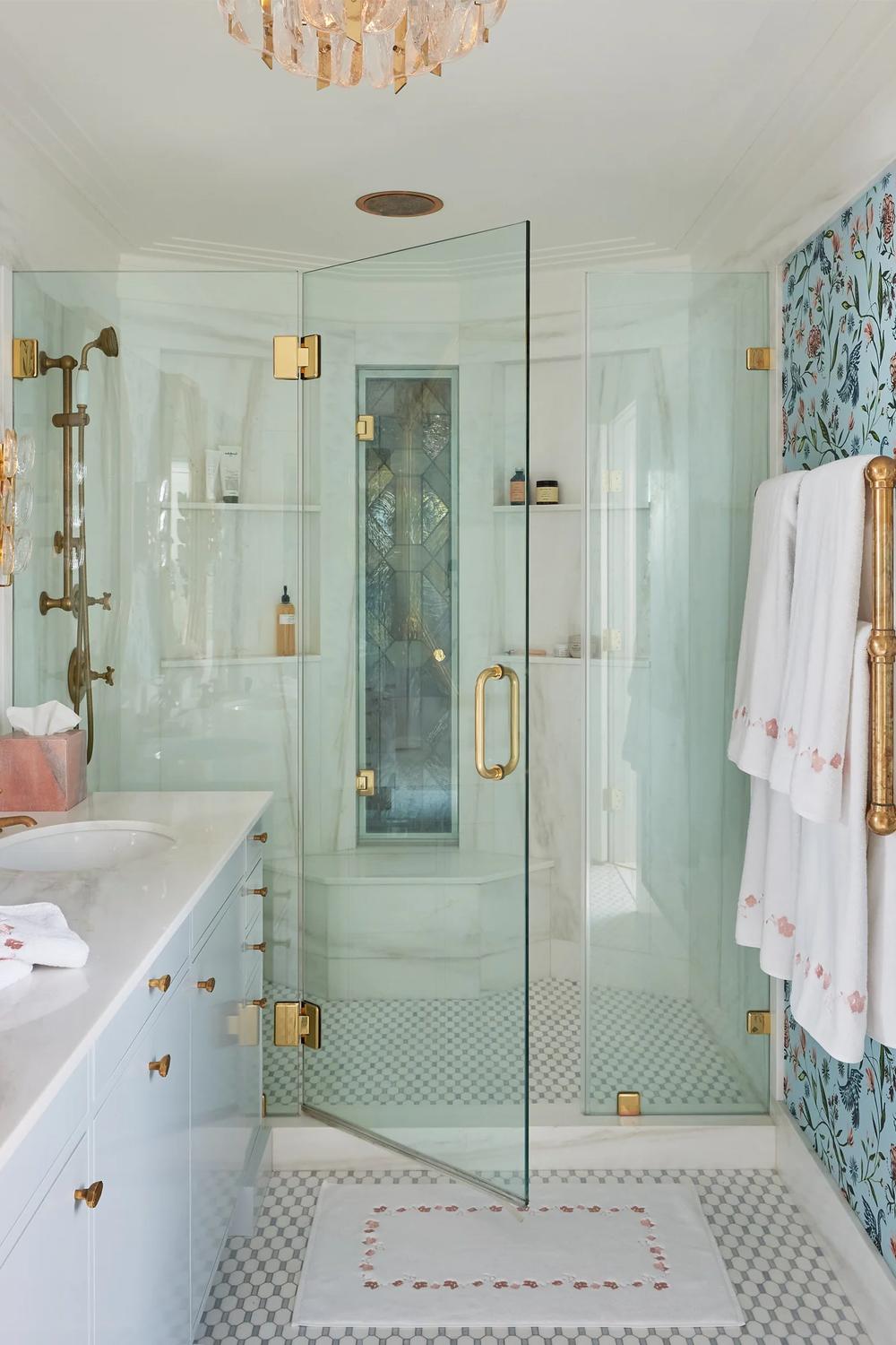 Colorful Chinoiserie wallpaper featuring floral designs in a sophisticated modern bathroom with elegant fixtures.