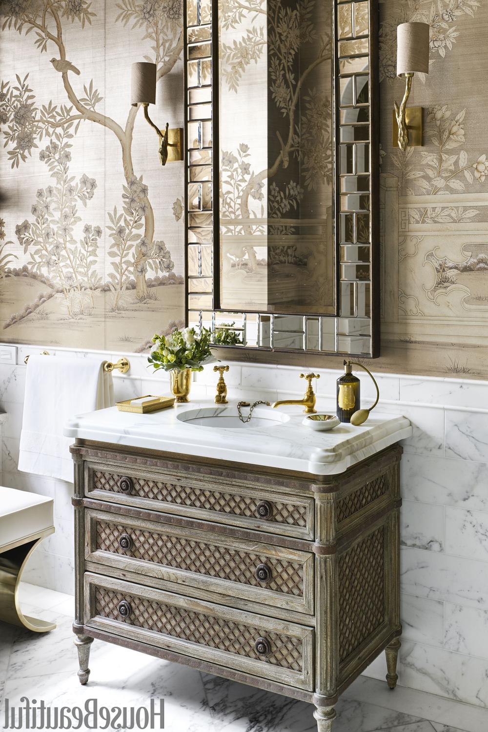 Charming bathroom featuring soft-toned chinoiserie wallpaper, vintage fixtures, and elegant lighting.