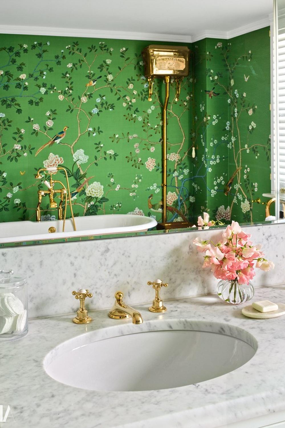 A chic bathroom featuring beautiful green Chinoiserie wallpaper with modern and traditional design elements.