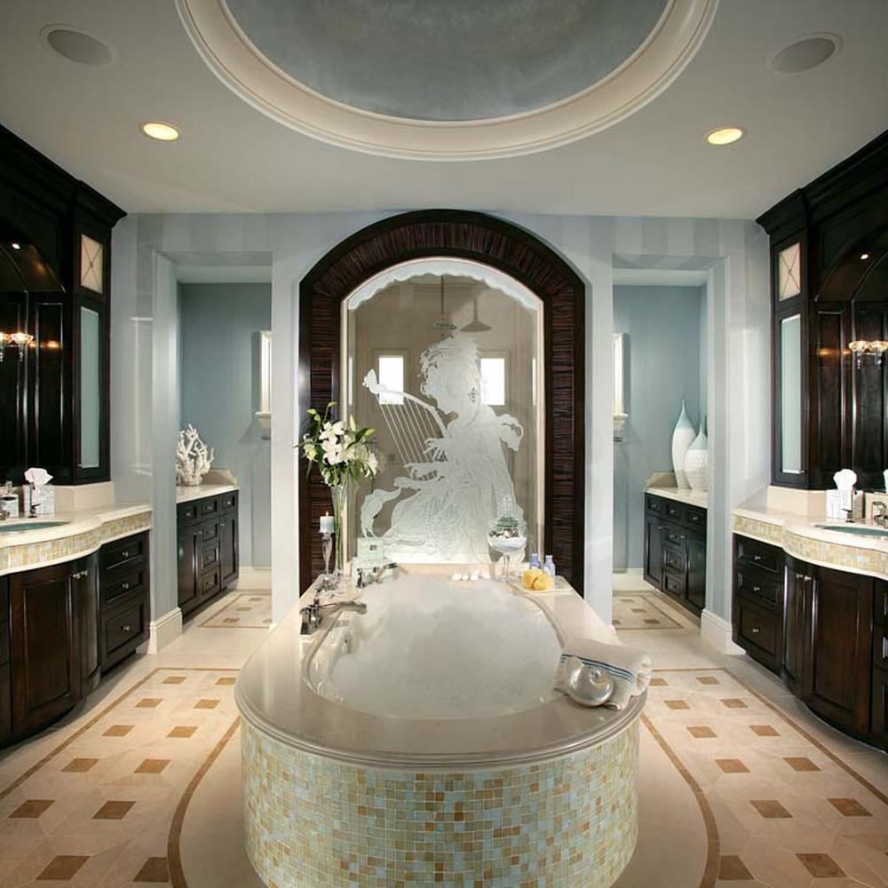 Beautifully designed bathroom featuring dark wooden cabinets contrasted with light-colored stone countertops and elegant accessories.