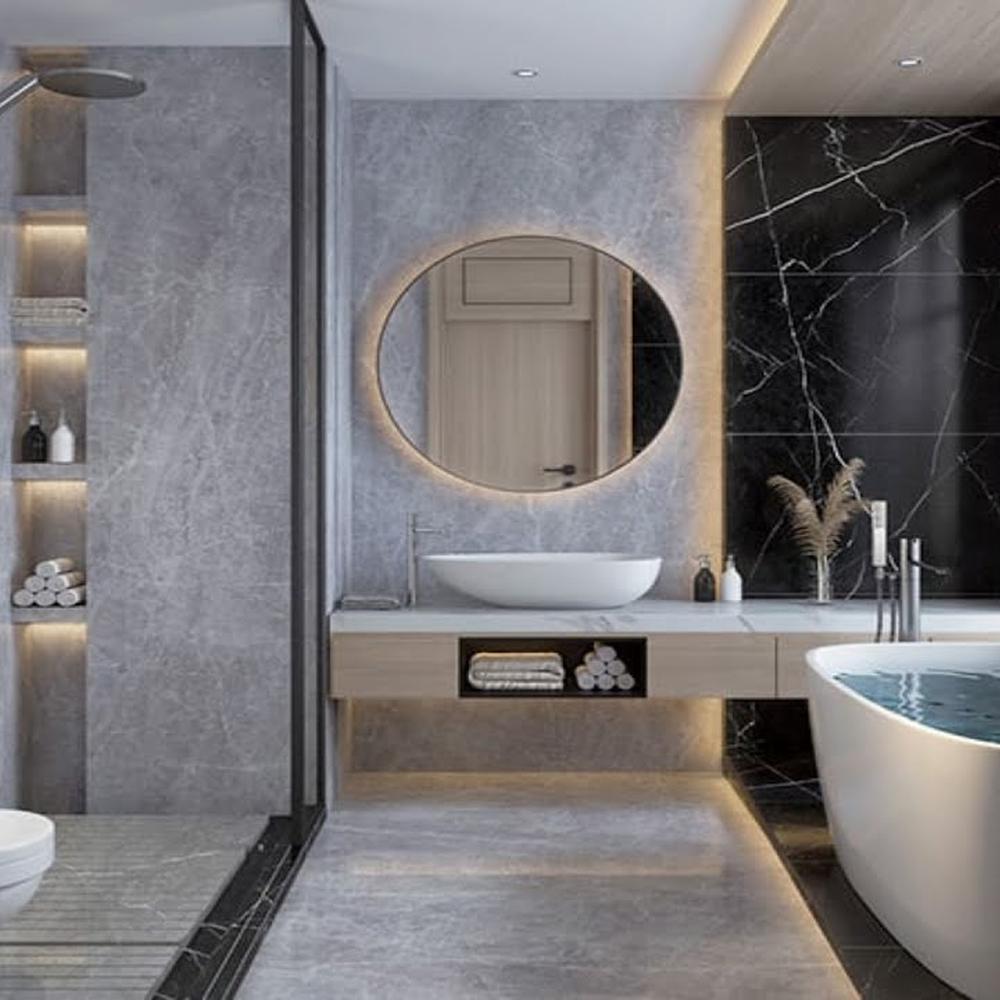 Sophisticated bathroom featuring gray and black tones with elegant lighting and modern finishes throughout.
