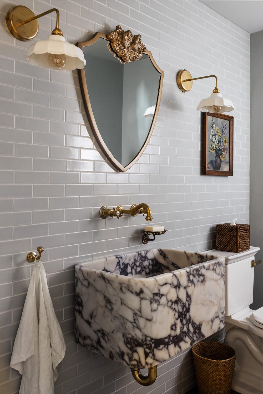 Vibrant colonial bathroom featuring colorful tiles and soft lighting.
