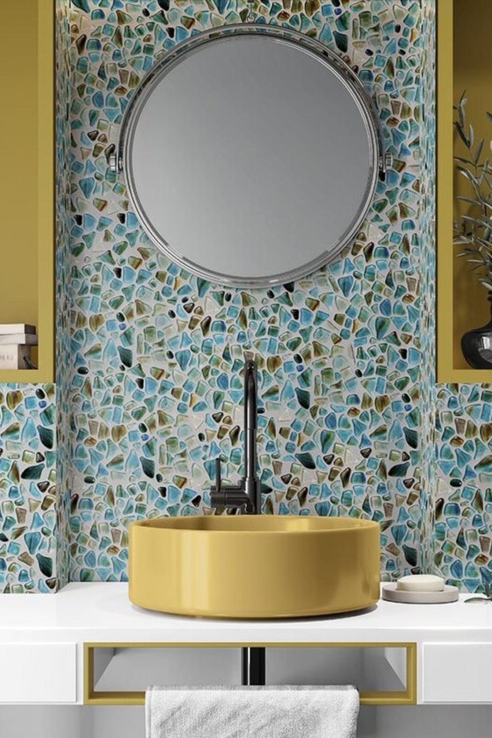 Modern bathroom with intricate mosaic tiles of blue, green, and earthy tones.