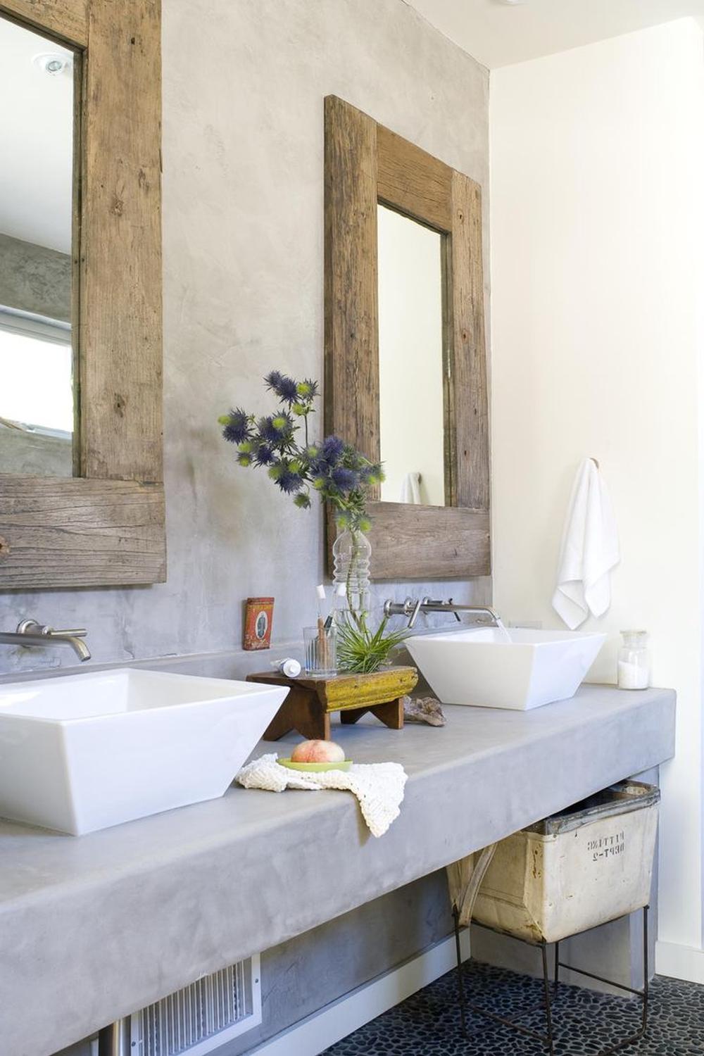 Contemporary Long Concrete Vanity with Vessel Sinks showcasing two white angular vessel sinks on a long concrete surface.