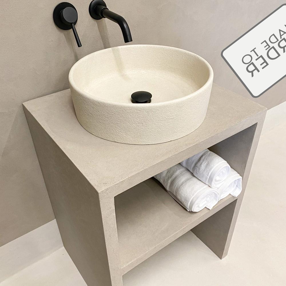 Industrial-Inspired Concrete Vanity with Raw Features and modern accessories.