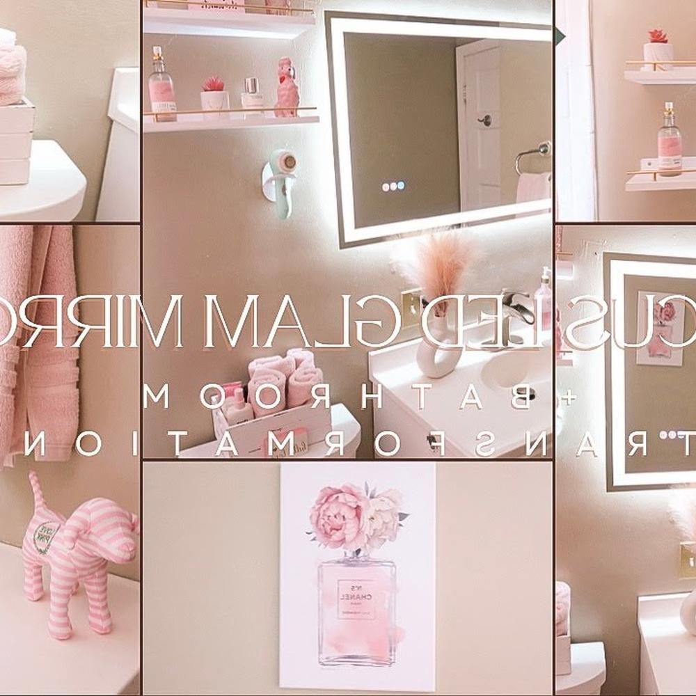 A coquette bathroom featuring an illuminated mirror and wooden shelves.