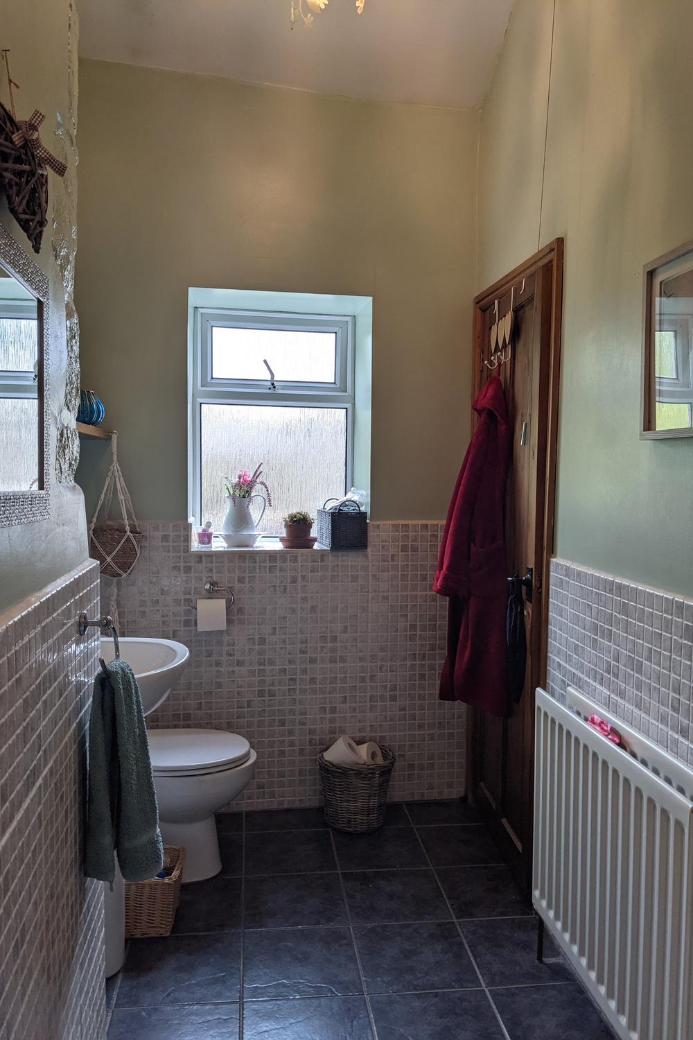 Cozy bathroom featuring gentle color palettes and practical design.