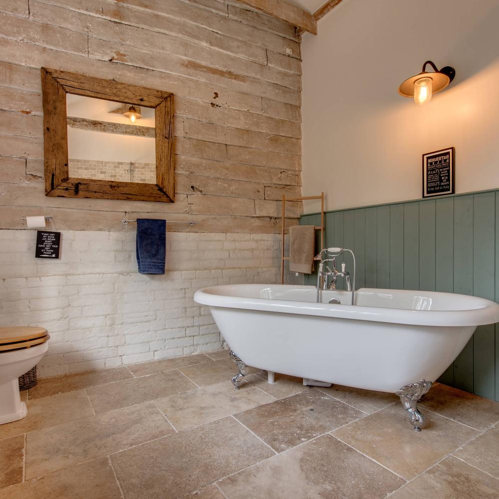 Country bathroom featuring harmonious materials and rustic charm