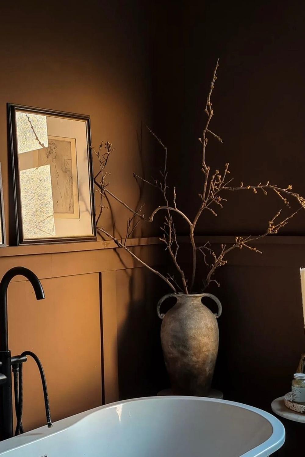 Beautifully designed dark brown bathroom emphasizing elegance and warmth.
